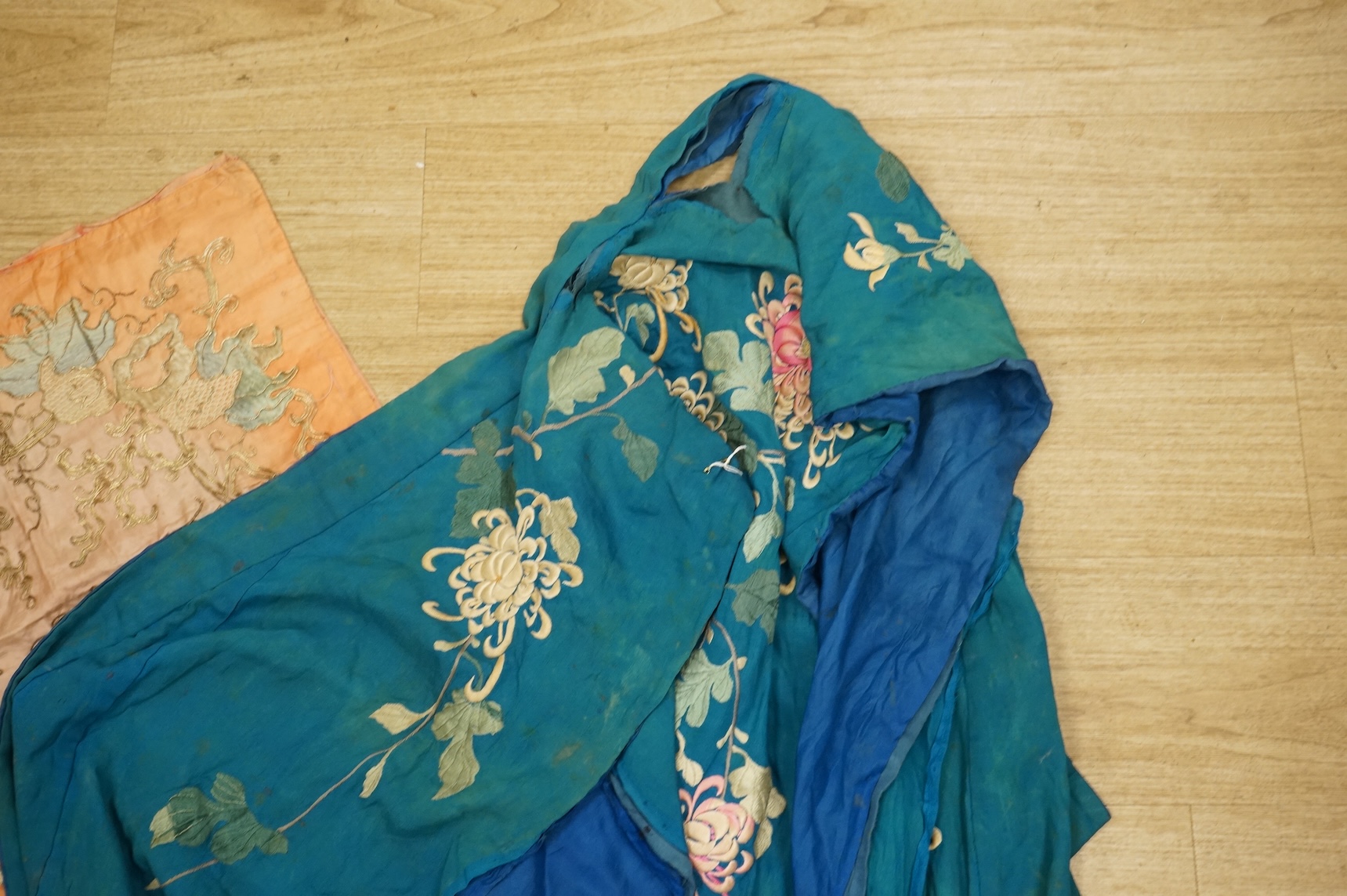 A collection of Chinese and Japanese embroidered kimonos and textiles
